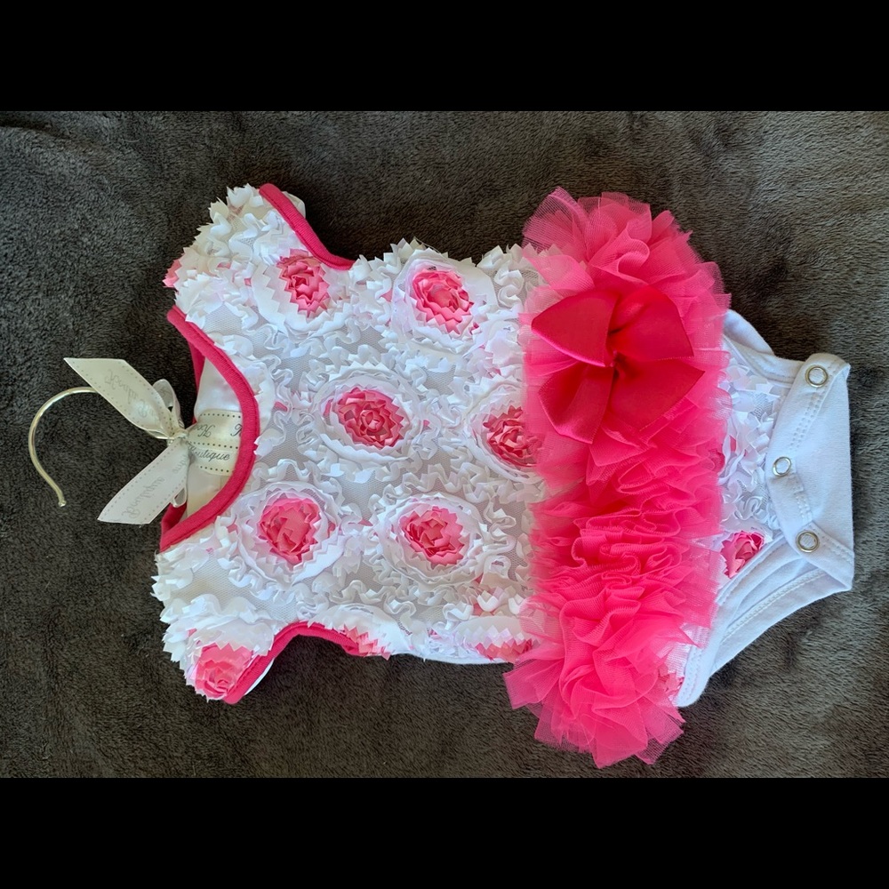 Baby girl frilly onesie with tutu.